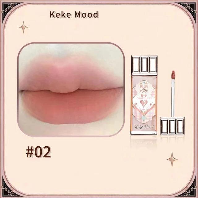 Chocolate Cloud Lip Glaze: Smooth, long-lasting brown-red tint.