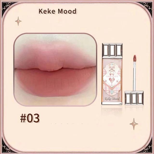 Chocolate Cloud Lip Glaze: Smooth, long-lasting brown-red tint.